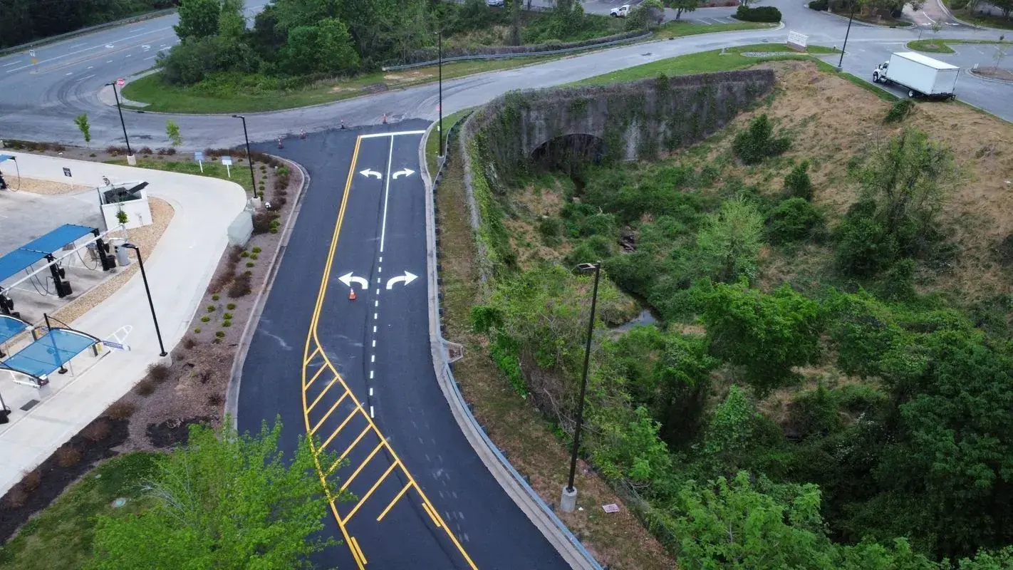 Aerial view of a newly paved private road with lane markings