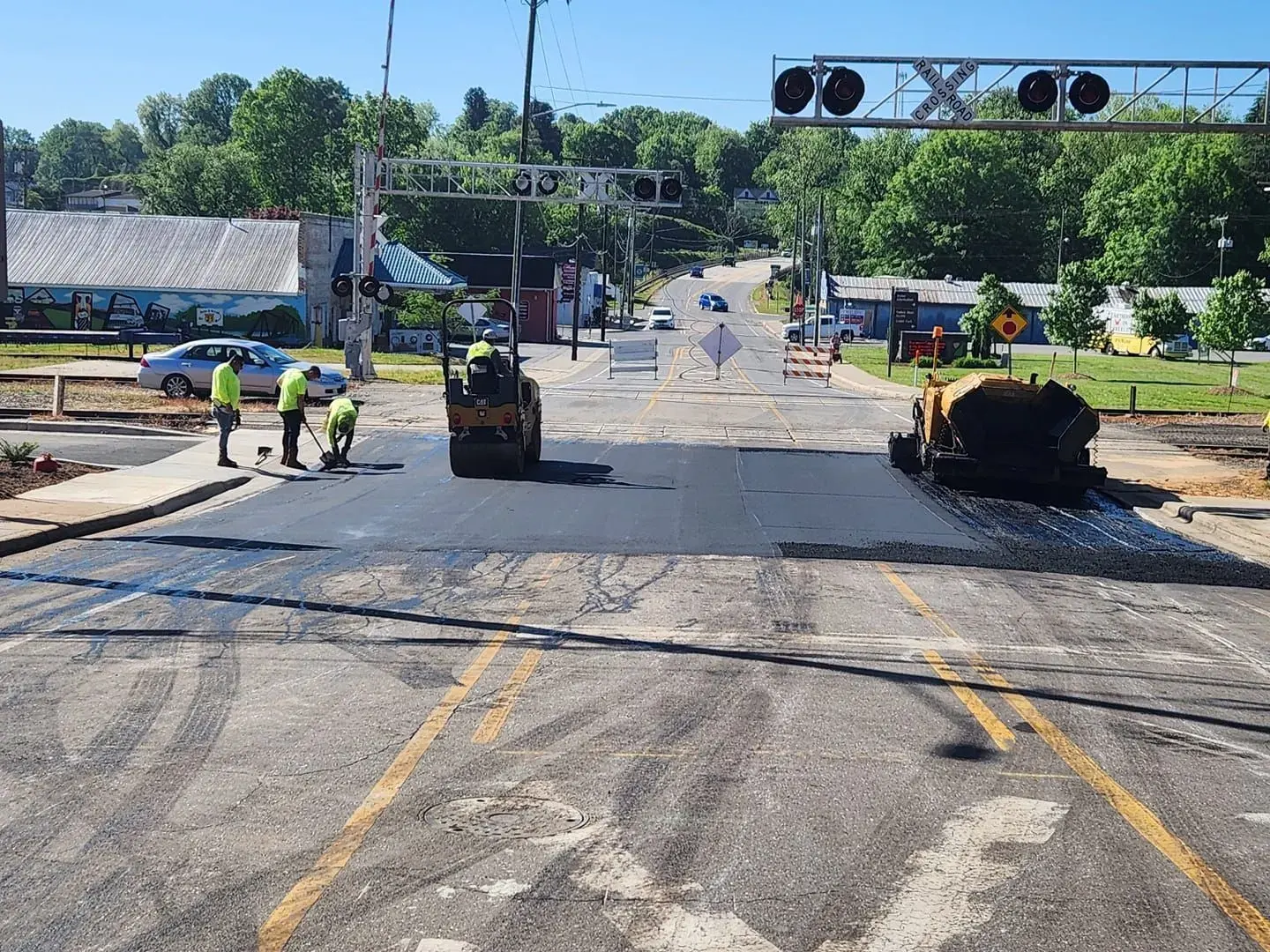 Asphalt crew laying a new surface course