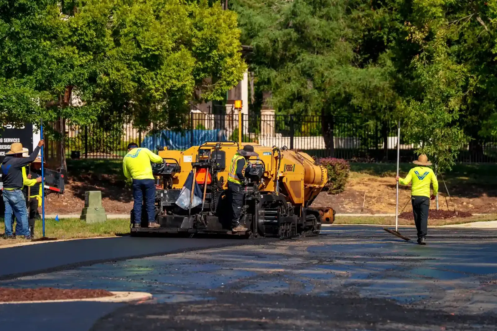 Victory Paving crew running an asphalt paver on a new asphalt installation