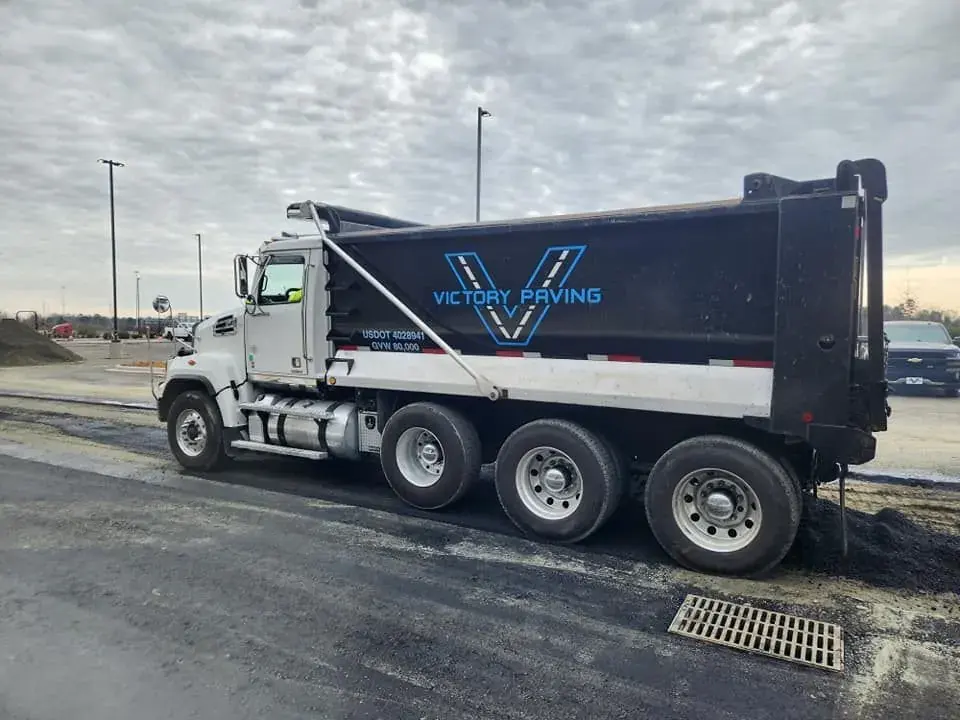 Victory Paving branded dump truck on a job site