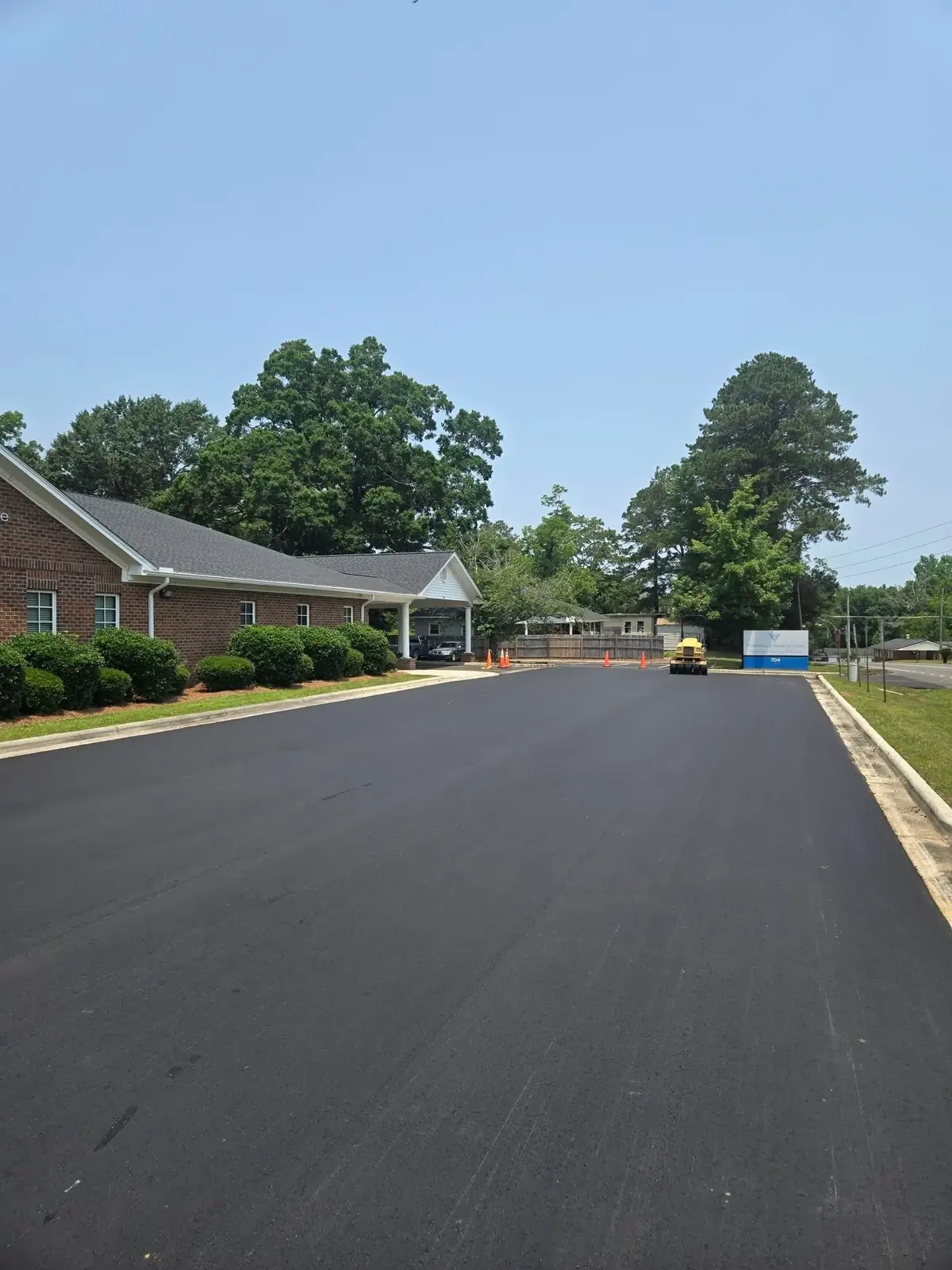 Newly paved parking lot beside a commercial building