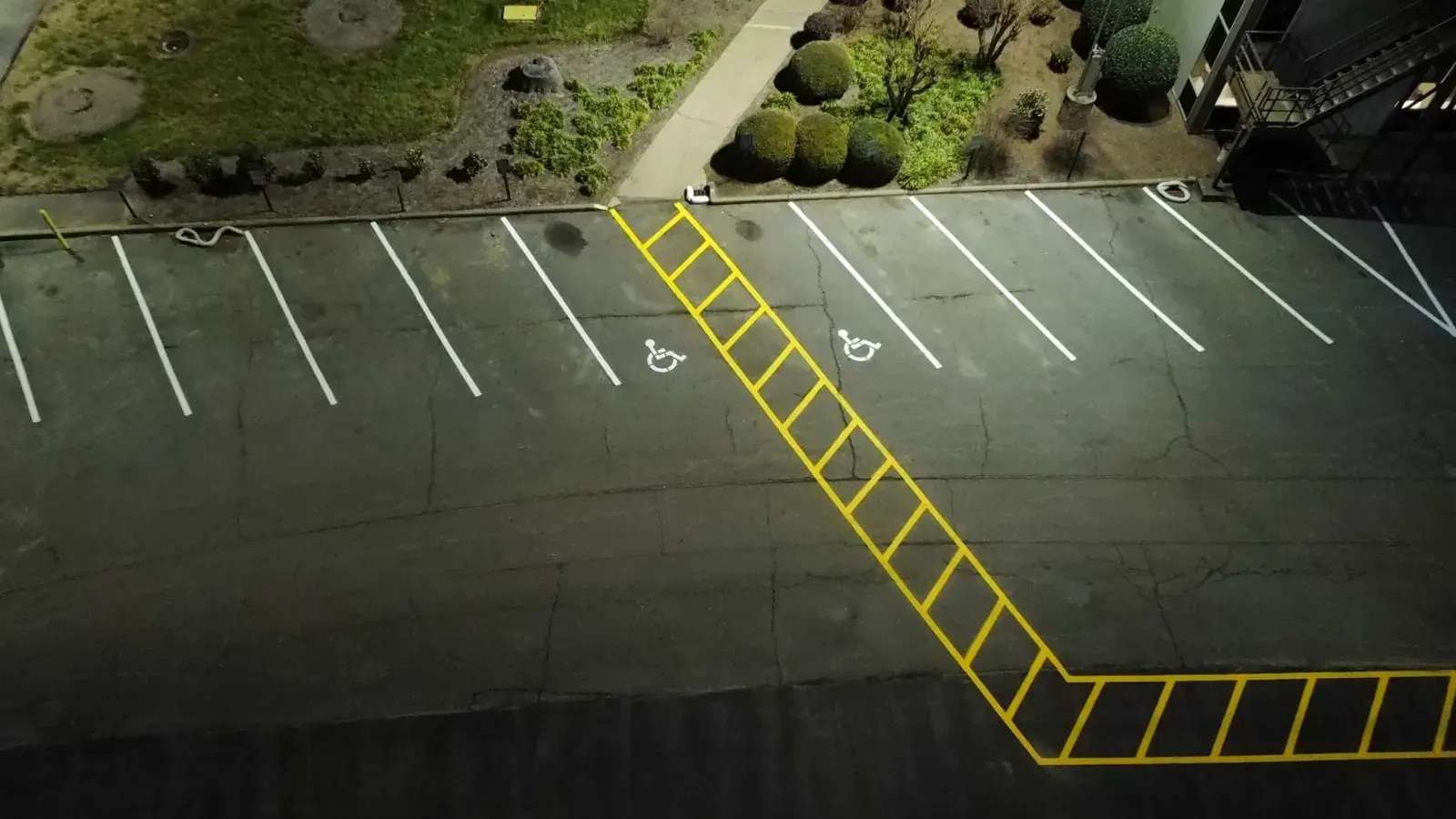 Commercial parking lot with fresh asphalt and fire lane striping