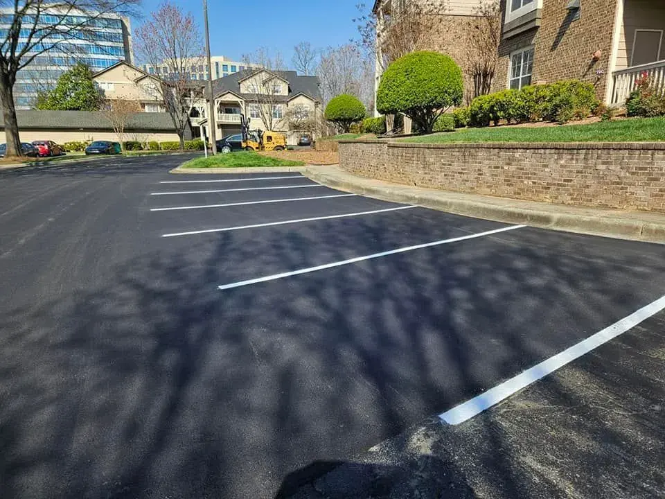 Resurfaced commercial parking lot with new striping